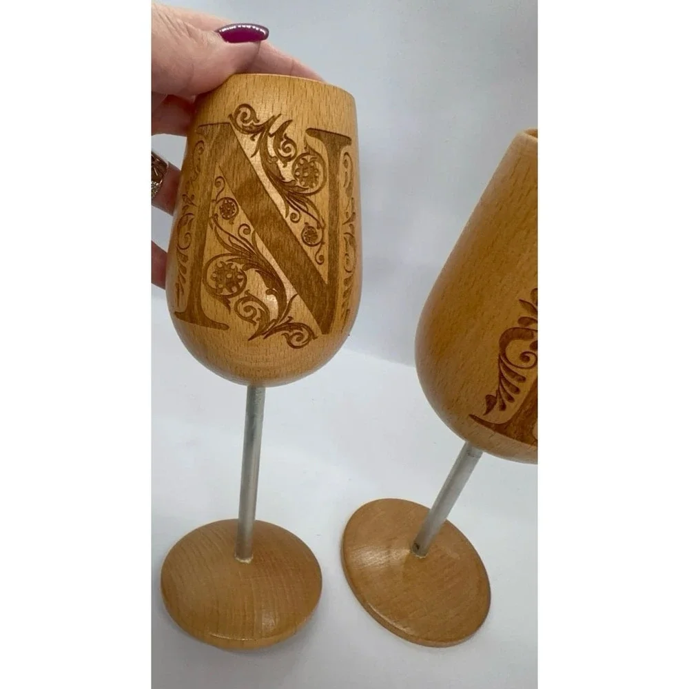 Two wooden monogrammed 'N' wine glasses. NEW.